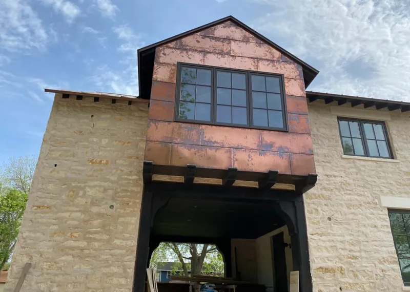 Copper metal panel facade on a stone building for Skylight Installation in Helena Valley Southeast