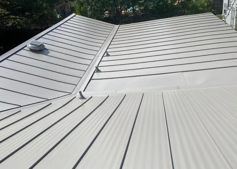 Solar attic fan installed on a metal roof for Roof Ventilation in Helena Valley Southeast
